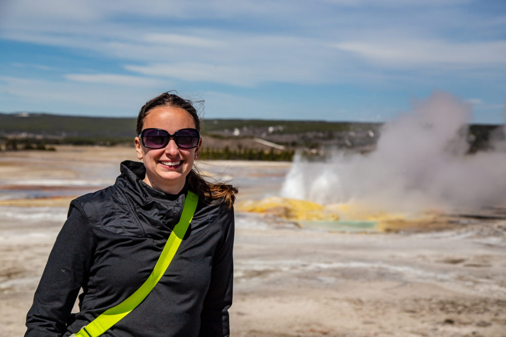 Leah next to fountain geyser along painted pots trail