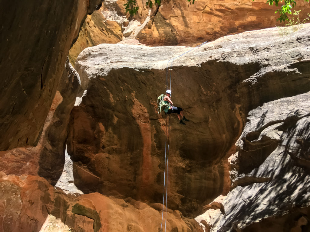 Rappelling in Cassidy Arch Canyon